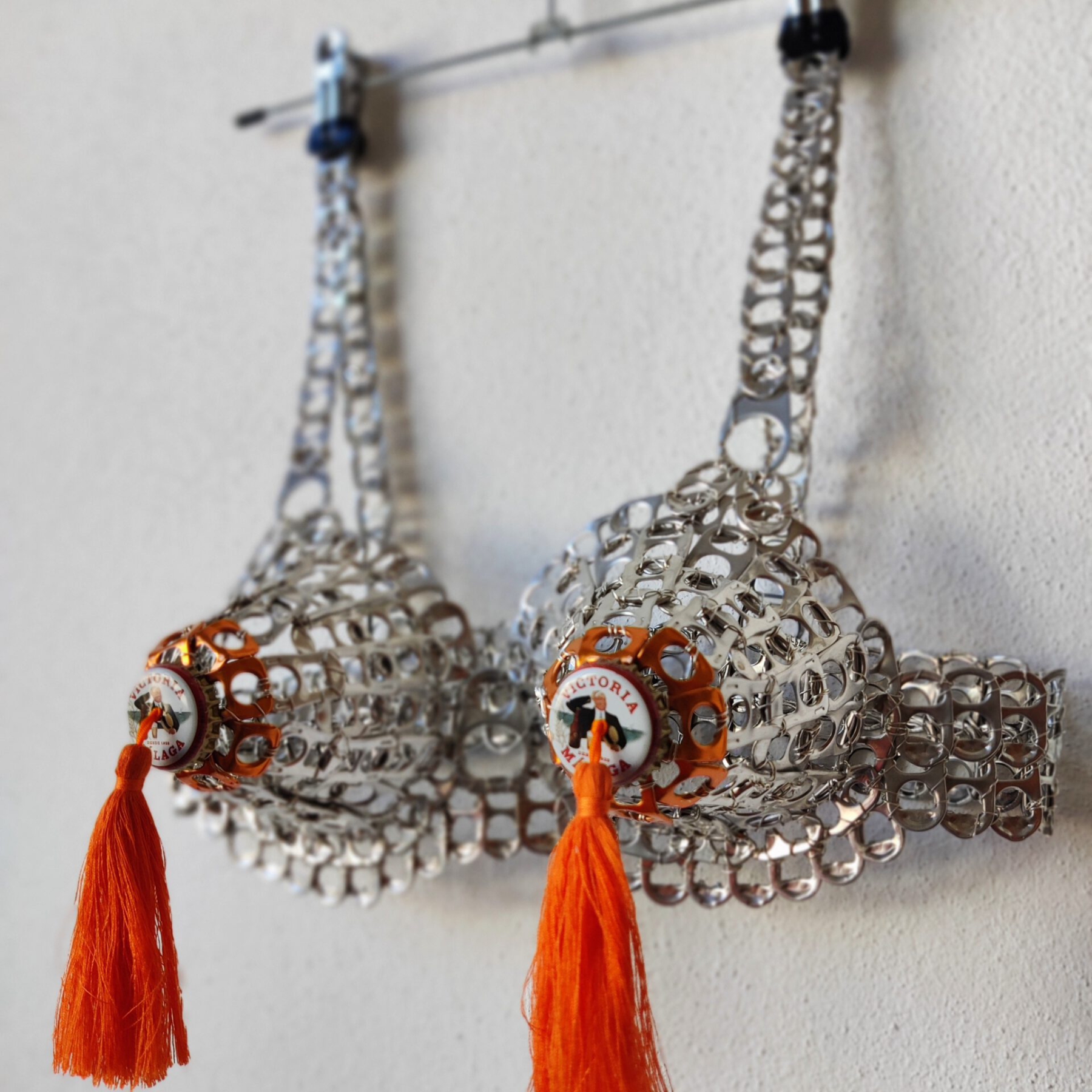Victoria (Orange Version), Safety Lingerie Series, can tabs, silver thread, beer caps, tassels by contemporary artist Nanon Morsink