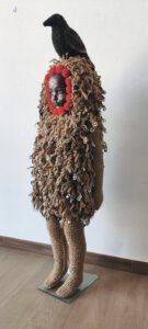 Sculptural work titled La Resistencia (de las tres virtudes de un artista) by contemporary artist Nanon Morsink, made from rope, wool, horns, can tab, nails, bird, and a doll.