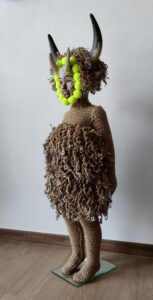 Sculptural work titled La Persistencia (de las tres virtudes de un artista) by contemporary artist Nanon Morsink, made from rope, wool, horns, can tabs, and a doll.