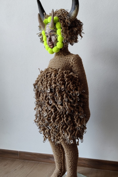 Sculptural work titled La Persistencia (de las tres virtudes de un artista) by contemporary artist Nanon Morsink, made from rope, wool, horns, can tabs, and a doll.