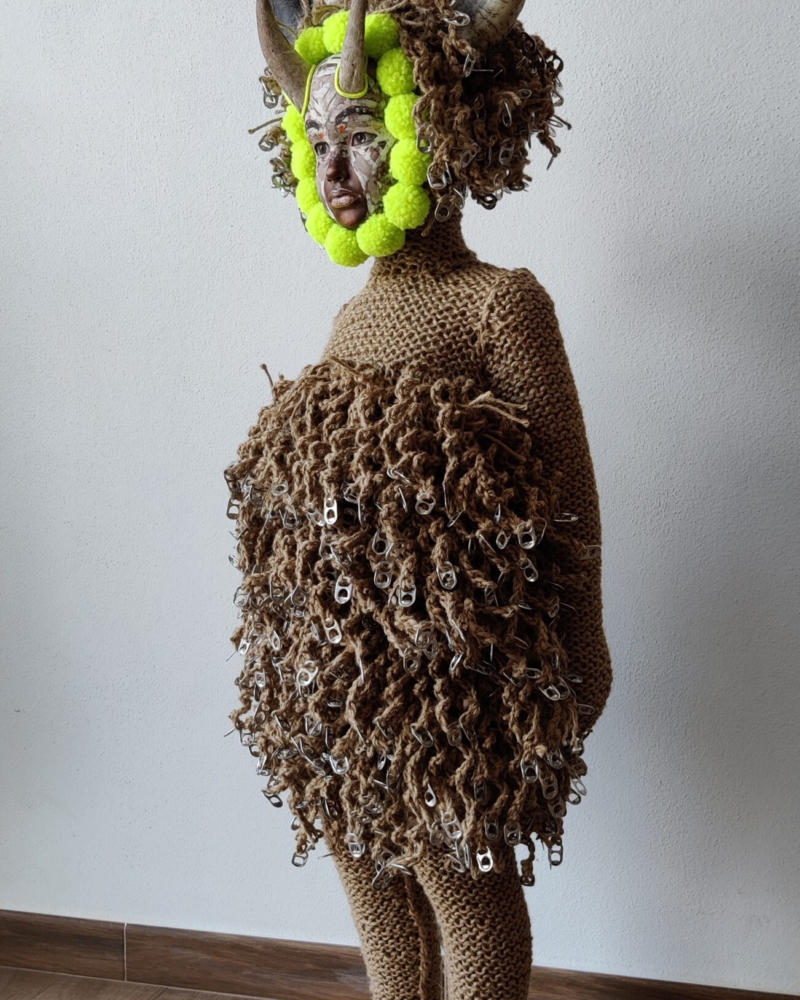 Sculptural work titled La Persistencia (de las tres virtudes de un artista) by contemporary artist Nanon Morsink, made from rope, wool, horns, can tabs, and a doll.