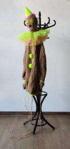 Sculptural installation titled Send in the clowns by contemporary artist Nanon Morsink, made from rope, tulle, wool, coat rack, confetti, and paint.