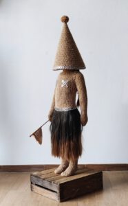 Sculptural work titled The party is over by contemporary artist Nanon Morsink, made from rope, can tabs, a doll, and hair.