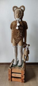 El oso de peluche, by Nanon Morsink. Contemporary textile sculpture made with rope, can tabs, ribbon, fiberfill, paint, and a doll. Mixed media fiber art. 120 x 45 x 30 cm.