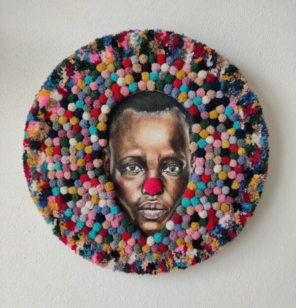 Soft sculpture ‘I Am Funny’ by Nanon Morsink (2025). Contemporary textile art with wool, acrylic paint, and pompons – round wall piece.