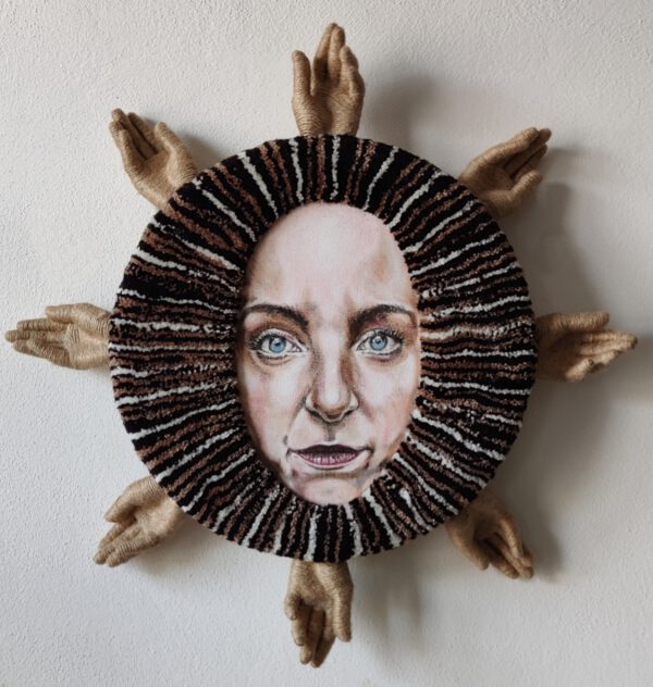 Fiber art sculpture titled “I Am the Sun” by Nanon Morsink, from the Soft Series. Contemporary textile wall piece made with tufted wool, acrylic paint, rope, and sculpted hands on board. 70 cm diameter, 2025. Bold and tactile mixed media art.